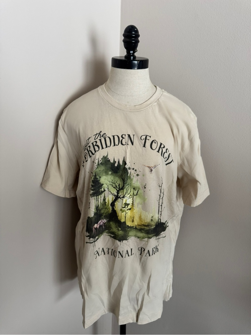Cream Short Sleeve Graphic Tee with Green Harry Potter Forbidden Forest Print